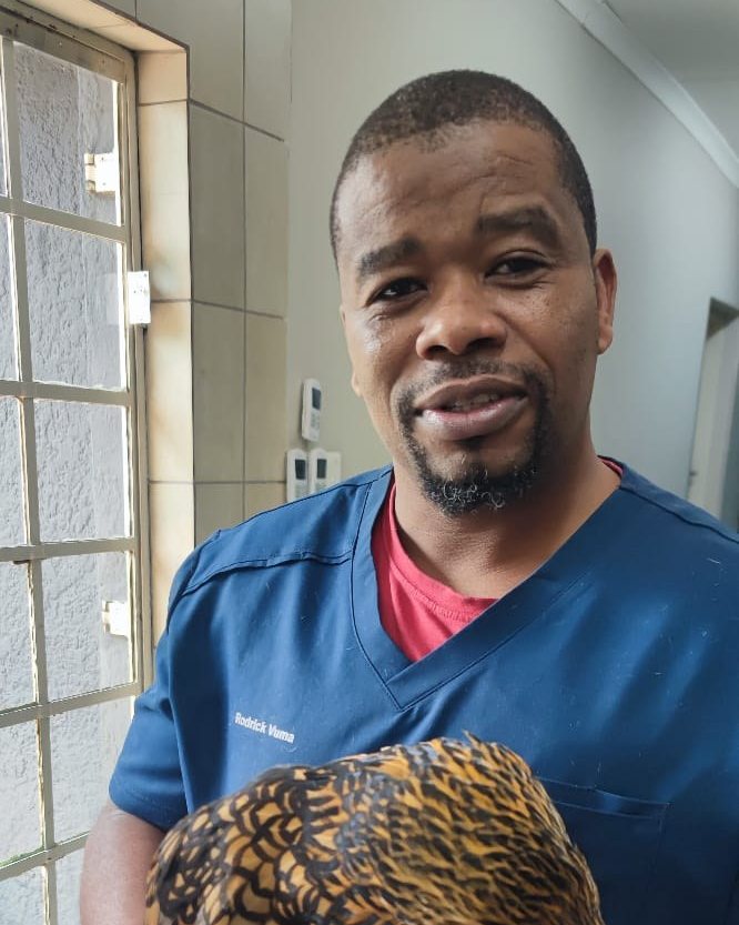Rodrick Vuma holding a hen